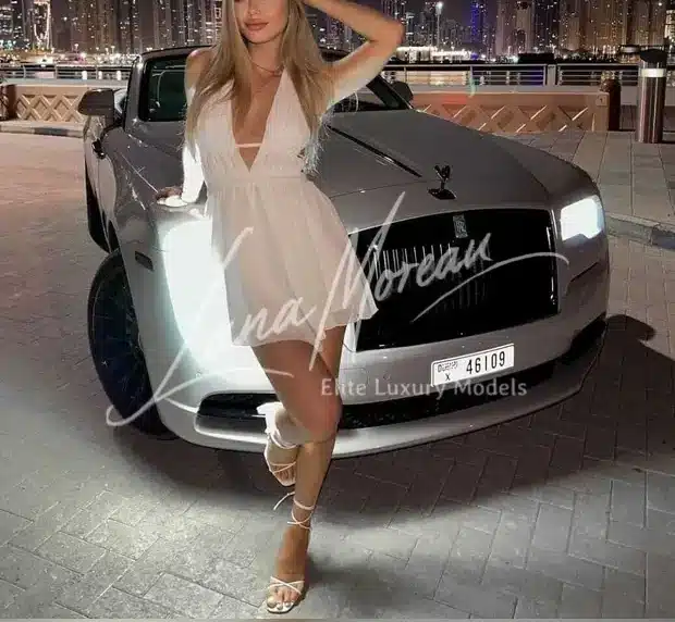 Elegant escort Alexandra in white dress