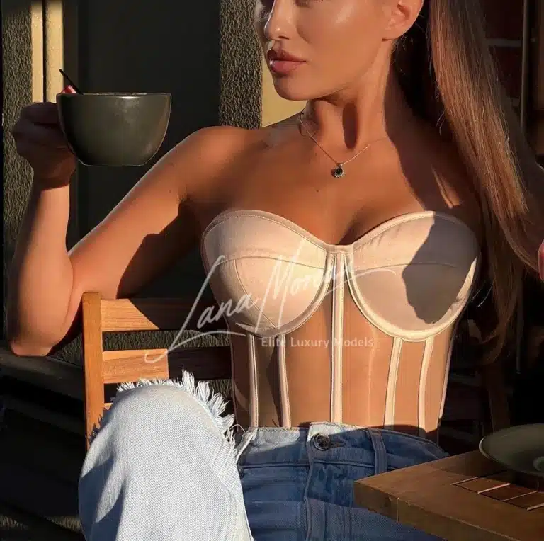 Blonde elite companion in corset top