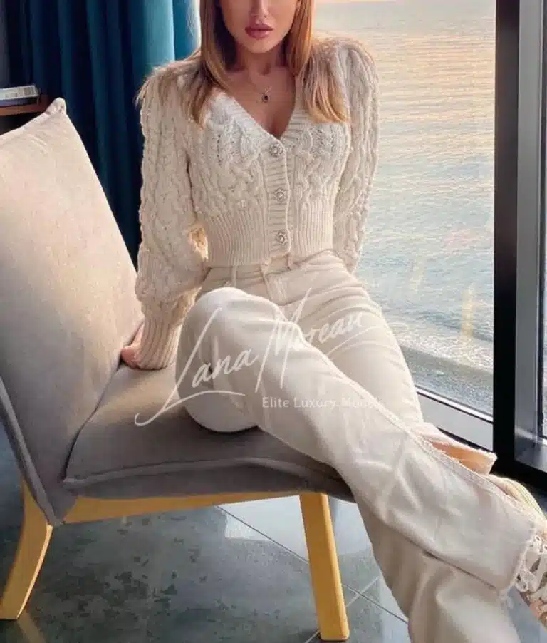 Chic elite escort in soft knitwear