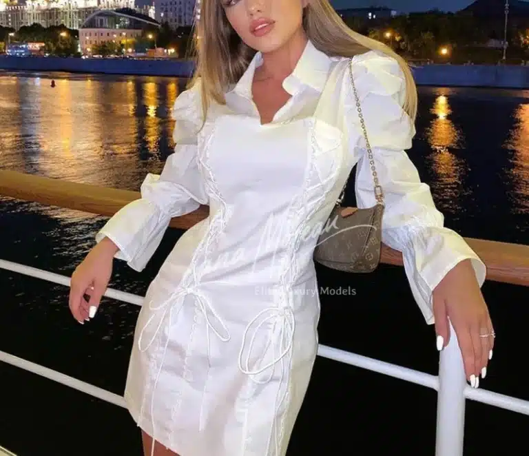 High class escort in elegant white dress