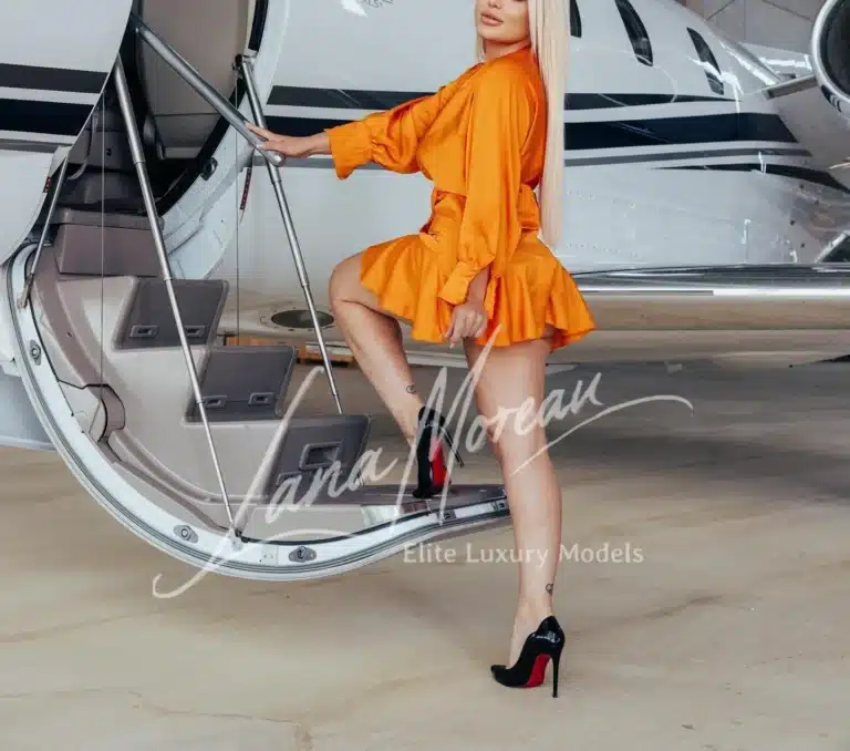 Escort Lady Boarding private jet in heels