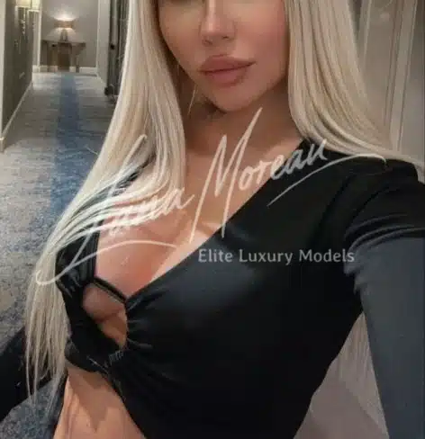 Blonde elite escort in sexy black top