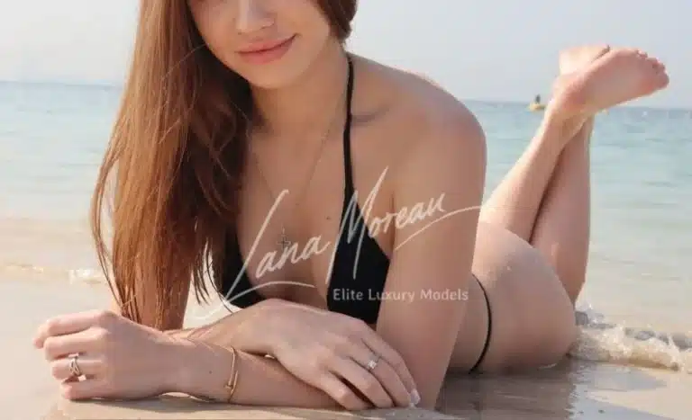 Beautiful Dubai model Stella smiling at the beach shore