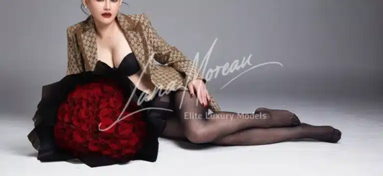 Luxury escort model with rose bouquet and designer blazer