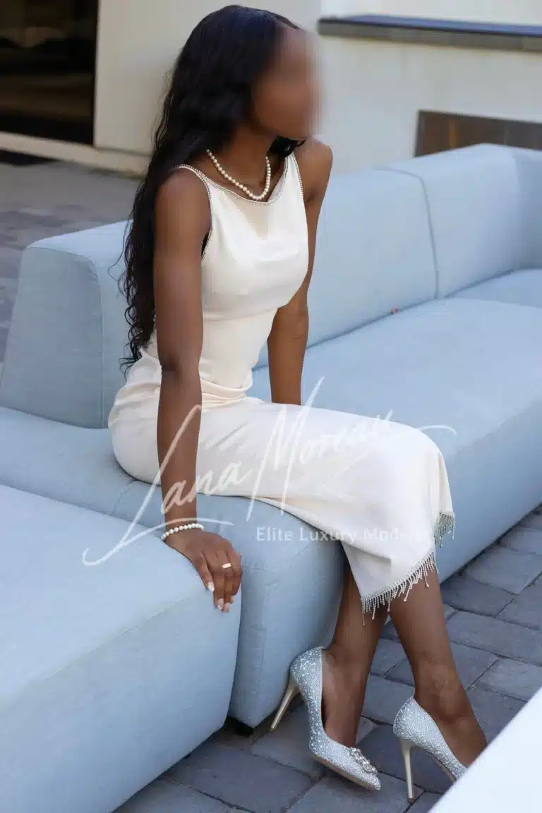Elegant black model in white dress