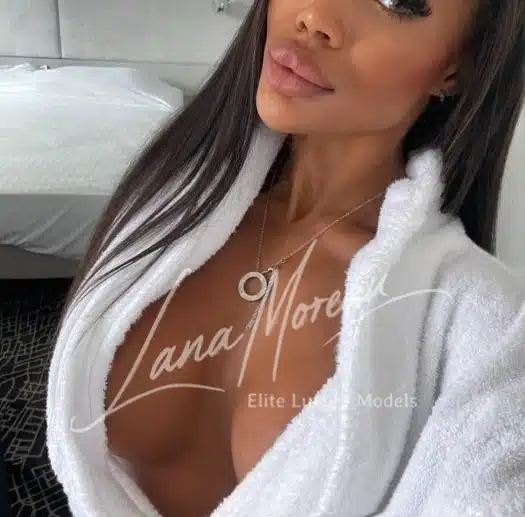 Seductive escort model in robe